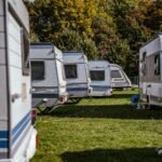 Motorhome parked at a scenic campsite during daylight hours illustrating the 3-3-3 rule for safe and relaxed travel